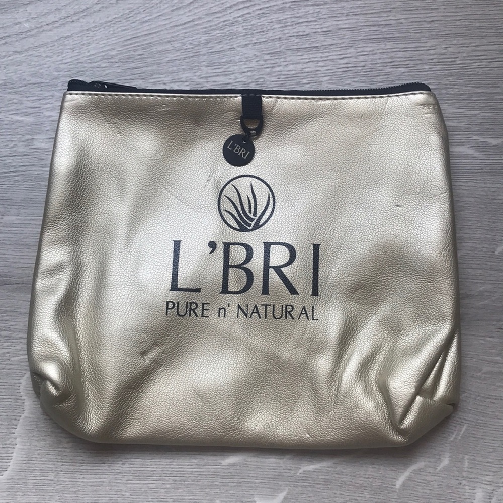 NWOT L’Bri gold cosmetic bag